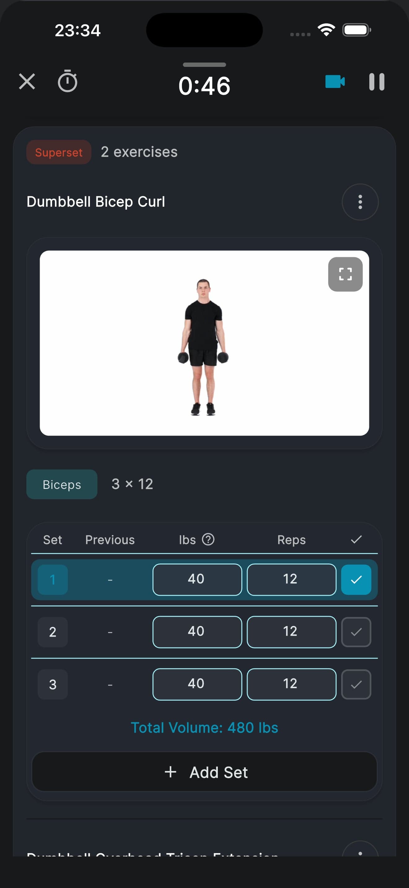 A workout 46 seconds in: a dumbbell bicep curl playing its demo video, three sets of 12 reps logged at 40 lbs, and a running total volume of 480 lbs.